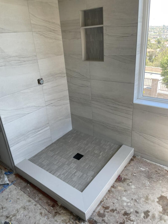 Corner shower 12x24 tile with shampoo niche