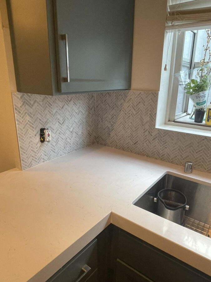 Herringbone mosaic backsplash